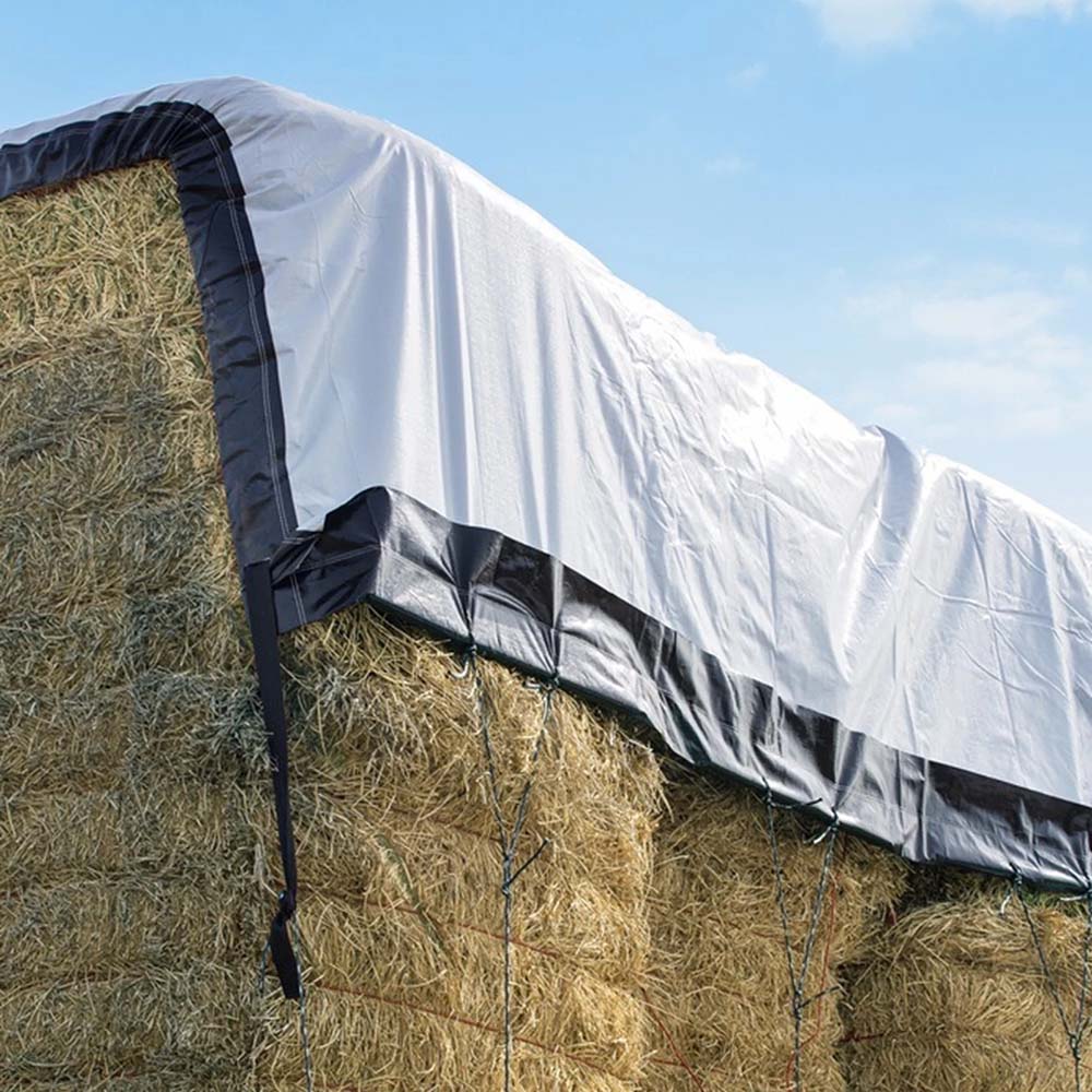 Inland performer hay tarp on stack of hay bales.