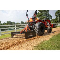 Bad Boy implement land grader on tractor.