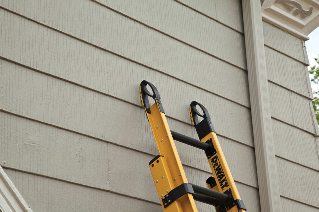 Dewalt ladder leaning against a house