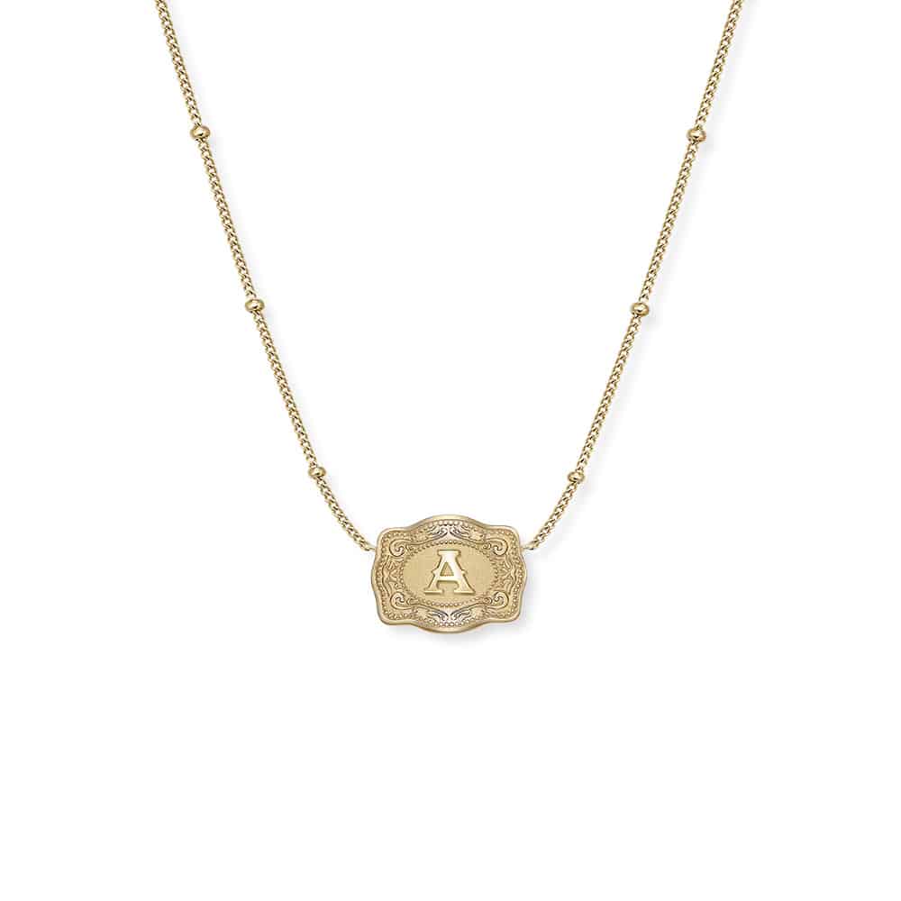Mini gold initial buckle necklace.