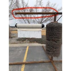 Ad on bar for cattle brush.